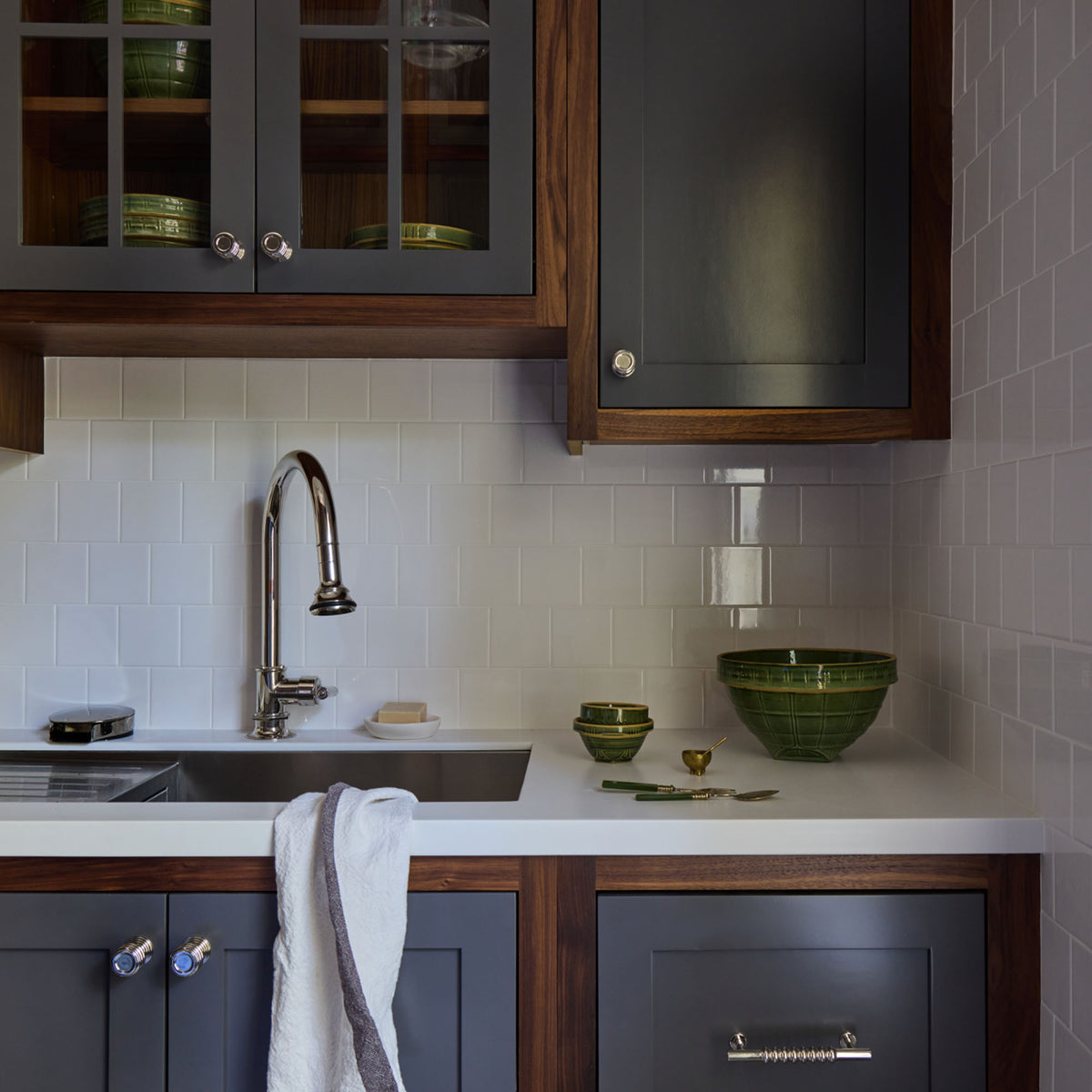 HW Tile 4x4 Perfect White Tile install in a kitchen with navy and wood cabinets